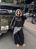 DAXUEN distressed black and white hooded jacket — model photo
