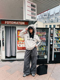DAXUEN distressed black and white hooded jacket — model photo