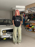 DAXUEN Black short-sleeved t-shirt with distressed text and graphics — model photo