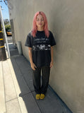 DAXUEN Black short-sleeved t-shirt with distressed text and graphics — model photo