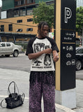 DAXUEN light grey and black distressed graphic raglan t-shirt — model photo