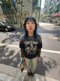 DAXUEN black layered t-shirt with distressed graphic — model photo