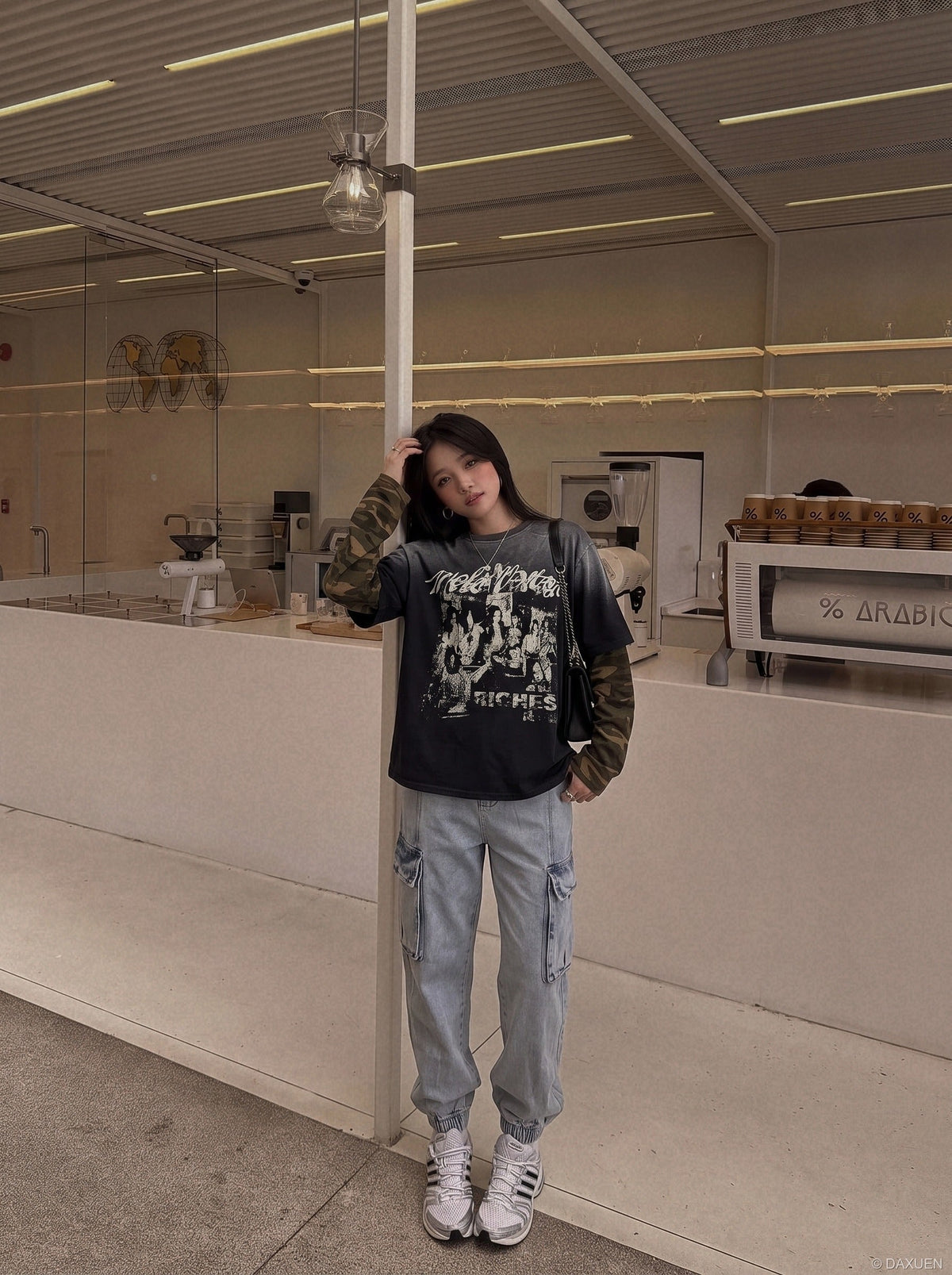 DAXUEN black layered t-shirt with distressed graphic — model photo