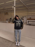 DAXUEN black layered t-shirt with distressed graphic — model photo