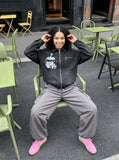 DAXUEN distressed black oversized zip jacket — model photo