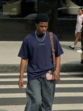 DAXUEN Distressed oversized short-sleeved t-shirt — model photo