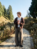 DAXUEN faded brown wide-leg sculptural pants — model photo