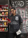 DAXUEN washed black oversized distressed camouflage layered long-sleeve tee — model photo