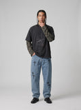 DAXUEN washed black oversized distressed camouflage layered long-sleeve tee — model photo