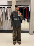 DAXUEN washed black oversized distressed camouflage layered long-sleeve tee — model photo