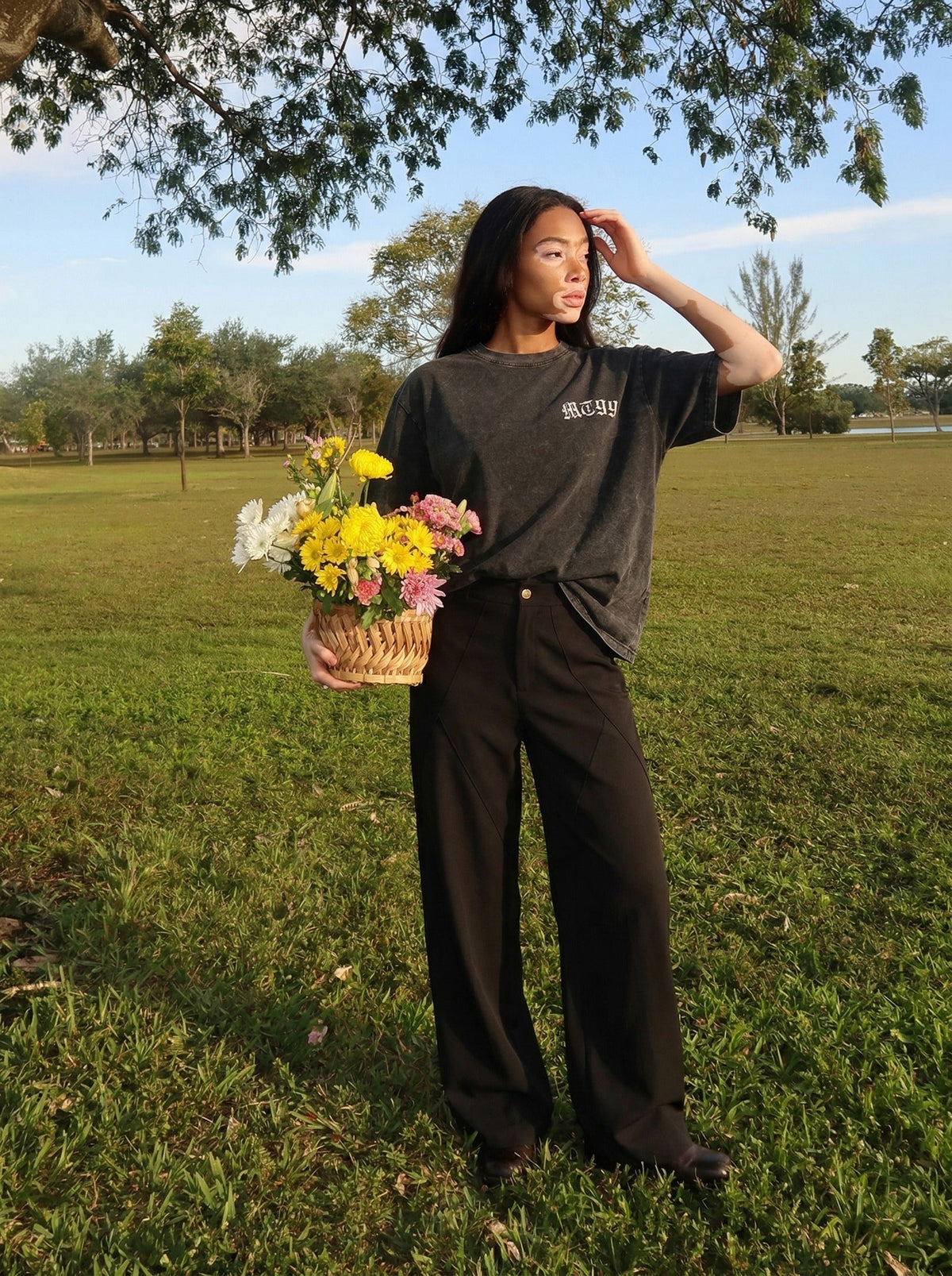 DAXUEN Distressed charcoal grey graphic t-shirt with gothic prints — model photo