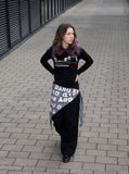 DAXUEN black long-sleeved polo with distressed cityscape graphic — model photo