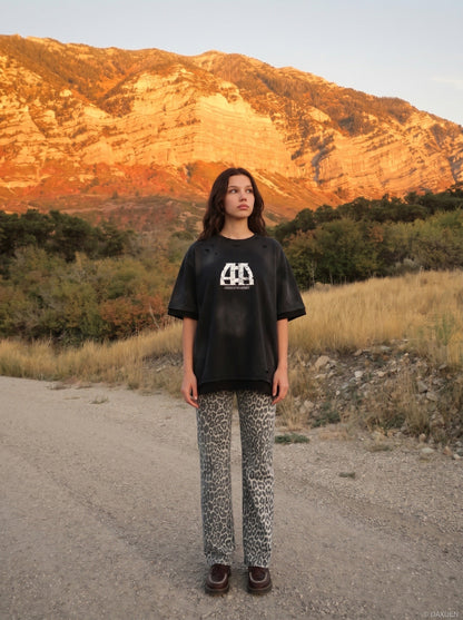 DAXUEN distressed cloud graphic oversized tee — model photo