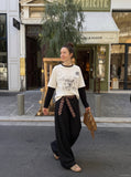 DAXUEN black distressed collegiate graphic layered t-shirt — model photo