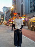 DAXUEN black distressed collegiate graphic layered t-shirt — model photo