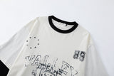 DAXUEN black distressed collegiate graphic layered t-shirt