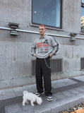 DAXUEN navy blue long-sleeve polo with distressed collegiate graphic — model photo