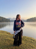 DAXUEN navy blue long-sleeve polo with distressed collegiate graphic — model photo