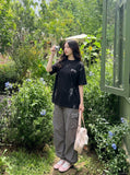 DAXUEN Distressed oversized crew neck t-shirt — model photo