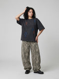 DAXUEN Distressed cross patch short-sleeved T-shirt — model photo