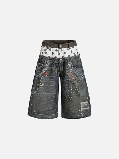 Dark grey wide-leg denim shorts featuring a double waistband with polka dots, metal chains, and stud detailing.