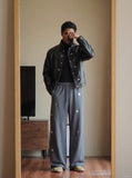 DAXUEN dark grey wide-leg pants with circular embellishments — model photo