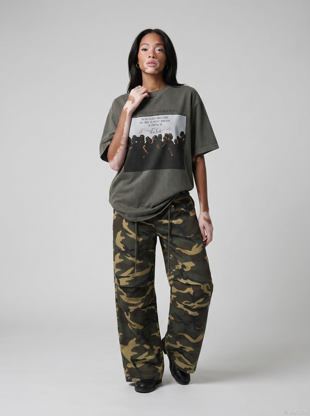 DAXUEN dark olive oversized silhouetted crowd graphic t-shirt — model photo