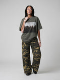 DAXUEN dark olive oversized silhouetted crowd graphic t-shirt — model photo