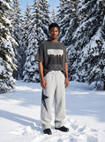 DAXUEN dark olive oversized silhouetted crowd graphic t-shirt — model photo