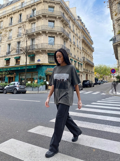 DAXUEN dark olive oversized silhouetted crowd graphic t-shirt — model photo
