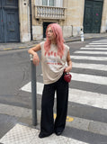 DAXUEN black oversized distressed face graphic tank — model photo