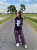 DAXUEN black oversized distressed face graphic tank — model photo