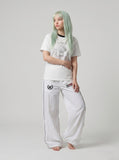 DAXUEN white t-shirt with distressed face graphic — model photo