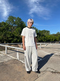 DAXUEN white t-shirt with distressed face graphic — model photo