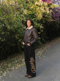 DAXUEN distressed black faux leather bomber jacket with fur collar — model photo