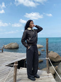 DAXUEN distressed black faux leather bomber jacket with fur collar — model photo