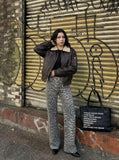 DAXUEN distressed black faux leather bomber jacket with fur collar — model photo