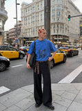DAXUEN olive green oversized distressed five-figure graphic t-shirt — model photo