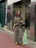 DAXUEN olive green oversized distressed five-figure graphic t-shirt — model photo