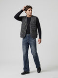 DAXUEN Distressed dark blue flared denim jeans — model photo