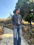 DAXUEN Men's wide-leg denim jeans with floral embroidery — model photo