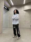 DAXUEN light blue and white vertical pinstripe distressed geometric button-up shirt — model photo