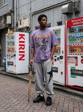 DAXUEN washed purple oversized graphic tee — model photo