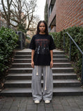 DAXUEN black oversized distressed gothic portrait graphic tee — model photo