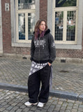 DAXUEN black and grey striped distressed graphic hoodie — model photo