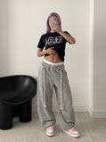 DAXUEN black oversized distressed graphic tee — model photo