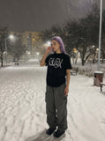 DAXUEN black oversized distressed graphic tee — model photo