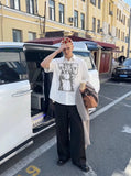DAXUEN Distressed graphic button-up shirt with short sleeves — model photo