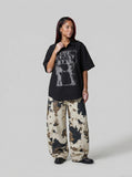 DAXUEN Distressed graphic button-up shirt with short sleeves — model photo