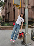 DAXUEN Distressed graphic crewneck T-shirt in white and grey melange — model photo